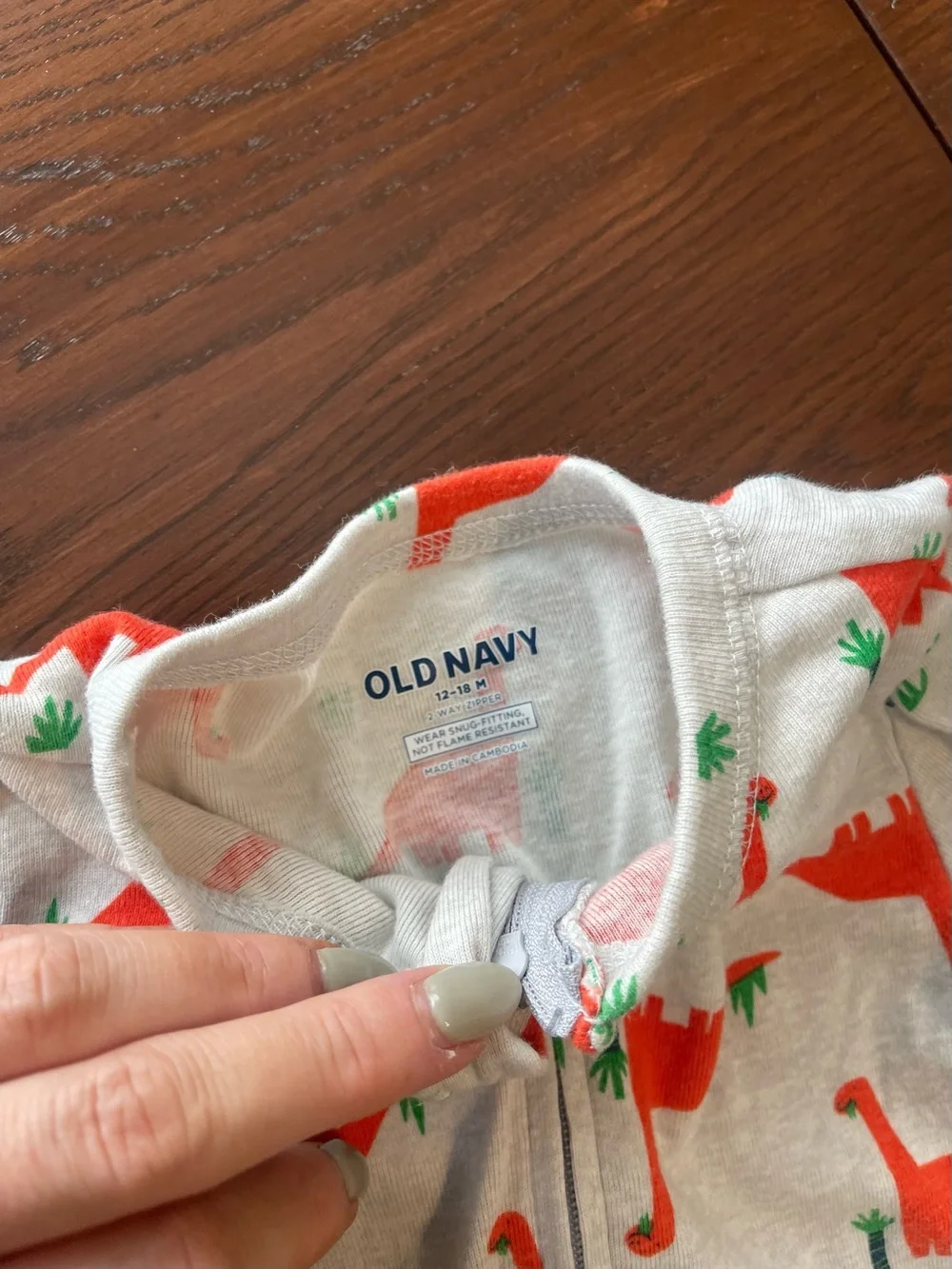 Old Navy Cream One-Piece Footie with Orange Dino Print